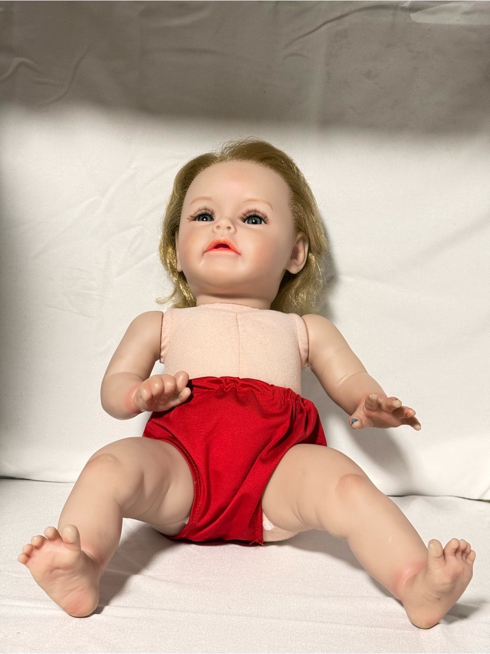 Realistic newborn Baby Doll with Blonde Hair in Red Bottom